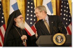 President George W. Bush smiles as he welcomes His Eminence Archbishop Demetrios to the White House Friday, March 23, 2007, to celebrate Greek Independence Day and to recognize the contributions of Greek-Americans to American culture. This year's ceremony also recognized the 40th anniversary of the episcopacy of the Archbishop. White House photo by Eric Draper