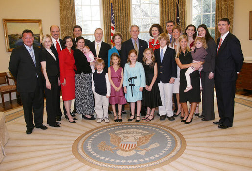 President George W. Bush and Mrs. Laura Bush pose for a photo with the family of former President Lyndon Baines Johnson in the Oval Office, Friday, March 23, 2007, following the signing of H.R. 584 designating the U.S. Department of Education in Washington, D.C., as the Lyndon Baines Johnson Federal Building. White House photo by Eric Draper