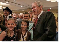 President George W. Bush poses for photos and meets guests following his remarks to the National Cattlemen’s Beef Association Wednesday, March 28, 2007 in Washington, D.C.  White House photo by Joyce N. Boghosian