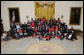 President George W. Bush poses with the Children’s Miracle Network Champions and leadership members in the East Room of the White House, Thursday, March 29, 2007, honoring the CMN organization for their work in helping save and improve the lives of children with severe medical challenges. White House photo by Eric Draper