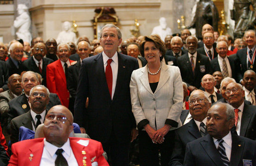 President George W. Bush and Speaker of the House Nancy Pelosi join 300 Tuskegee Airmen in Statuary Hall at the U.S. Capitol for a photograph Thursday, March 29, 2007. The group photo was part of the Congressional Gold Medal ceremony honoring America’s first African-American military airmen. White House photo by Eric Draper