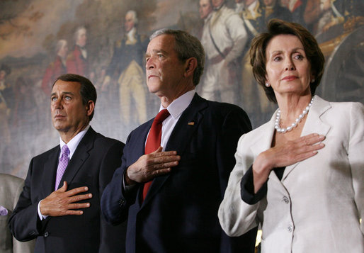 President George W. Bush stands with House Minority Leader John Boehner and Speaker of the House Nancy Pelosi for the playing of the National Anthem Thursday, March 29, 2007, during Congressional Gold Medal ceremonies honoring the Tuskegee Airmen. White House photo by Eric Draper