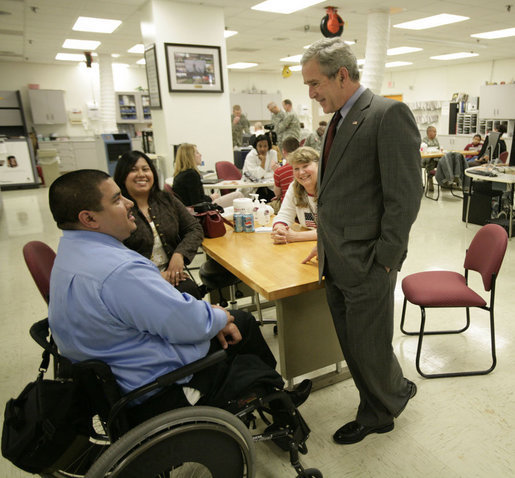 President George W. Bush talks with U.S. Army Staff Sgt. Joe Beimfohr and his fiancee Ana Rivera, both of Winchester, Tenn., located near Chattanooga Friday, March 30, 2007, during a visit to Walter Reed Army Medical Center in Washington, D.C. White House photo by Eric Draper