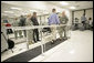 President George W. Bush watches U.S. Army 1st Lt. Scott Anthony Quilty of Francetown, N.H., demonstrate his walking abilities Friday, March 30, 2007, during a visit to Walter Reed Army Medical Center in Washington, D.C. Standing with the President is Lt. Quilty’s wife U.S. Army Capt. AnnMarie Dora Quilty. Lt. Quilty was later awarded the Purple Heart by President Bush. White House photo by Eric Draper