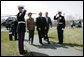 President George W. Bush and Mrs. Laura Bush walk with Brazilian President Luiz Inacio Lula da Silva past an honor guard Saturday, March 31, 2007, during Lula’s welcome to Camp David. White House photo by Eric Draper