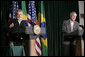 President George W. Bush listens as Brazilian President Luiz Inacio Lula da Silva answers a reporter’s question during their joint news conference Saturday, March 31, 2007, at Camp David. White House photo by Eric Draper