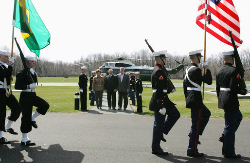 President George W. Bush and Mrs. Laura Bush welcome Brazilian President Luiz Inacio Lula da Silva Saturday, March 31, 2007 to Camp David, as a military honor guard passes in review. White House photo by Joyce Boghosian