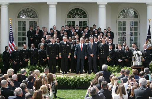 President George W. Bush welcomes members the U. S. Naval Academy football team to the White House, where he presented the Commander-In-Chief trophy to the team in ceremonies in the Rose Garden at the White House, Monday, April 2, 2007. White House photo by Joyce Boghosian