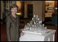 Mrs. Laura Bush stands next to 51 State Eggs decorated by artists from each state and the District of Columbia Tuesday, April 3, 2007, at the White House Visitor Center in Washington, D.C. The tradition of the State Egg Display for Easter began in 1994. Each year the artists vote amongst themselves to select the artist to create the following year’s commemorative egg which is presented to the President and First Lady. White House photo by Shealah Craighead