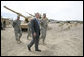 President George W. Bush talks with U.S. Army Captain Pat Armstrong during his visit to the U.S. Army National Training Center Wednesday, April 4, 2007, at Fort Irwin, Calif.  White House photo by Eric Draper