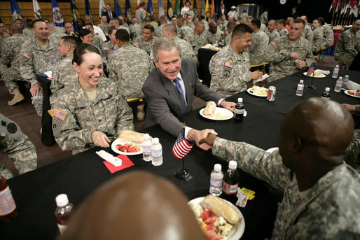 President George W. Bush greets military personnel during lunch at Fort Irwin, Calif., where President Bush addressed the troops and their family members at the U.S. Army’s National Training Center. White House photo by Eric Draper