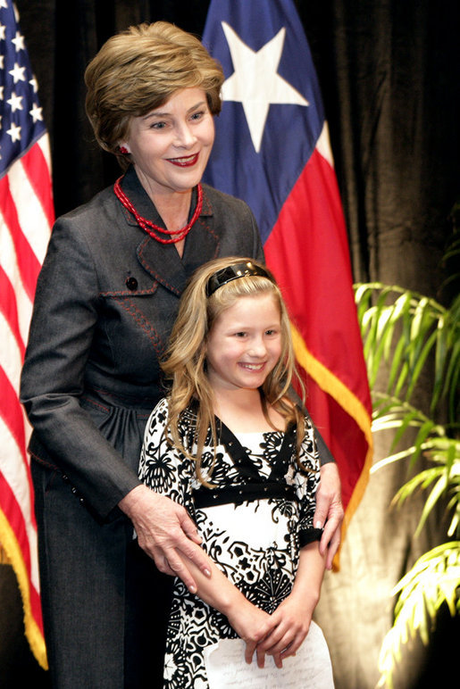 Mrs. Laura Bush hugs Rae Leigh Bradbury Wednesday, April 4, 2007, in Austin, after the 9-year-old introduced Mrs. Bush during the announcement of the future opening of the Texas Regional Office of the National Center for Missing and Exploited Children. Rae Leigh was the first child in the United States to be recovered as a result of an AMBER Alert when she was 8 weeks old in November 1998. So far AMBER Alerts have saved more than 300 young lives in the United States. White House photo by Shealah Craighead