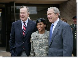 President George W. Bush and his father former President George H.W. Bush stand with Sergeant Shenika Hampton after attending an Easter church service at Fort Hood, Texas, Sunday, April 8, 2007. White House photo by Eric Draper