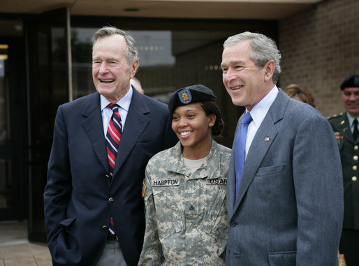 President George W. Bush and his father former President George H.W. Bush stand with Sergeant Shenika Hampton after attending an Easter church service at Fort Hood, Texas, Sunday, April 8, 2007. White House photo by Eric Draper