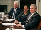 President George W. Bush talks with the press Thursday, April 12, 2007, after meeting about the No Child Left Behind Act with leaders in education, business the civil rights movement in the Roosevelt Room. Pictured with the President are Bill Taylor, Chairman of the Citizens' Commission on Civil Rights, and Shelia Evans-Tranumn, Associate Commissioner of Education for New York State. White House photo by Joyce N. Boghosian