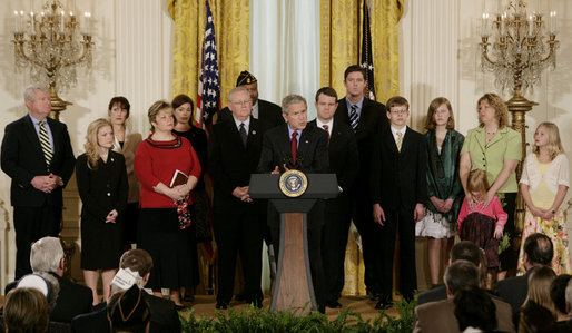 President George W. Bush, joined by military family members, addresses his remarks on the Iraq War supplemental spending bill in the East Room at the White House, Monday, April 16, 2007. President Bush urged Congress to pass an emergency war spending bill, without strings and without further delay. White House photo by Joyce Boghosian