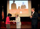 Mrs. Lynne Cheney hands out a copy of, “The Citizen’s Almanac,” during a special naturalization ceremony at the National Archives Tuesday, April 17, 2007, in Washington, D.C. 