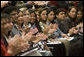 Arlene Oftedahl of Burke, Va., center, is all smiles as she and some of America’s newest citizens applaud Mrs. Cheney as she delivers her remarks during a special naturalization ceremony at the National Archives Tuesday, April 17, 2007, in Washington, D.C. 