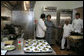 Mrs. Laura Bush tours the new kitchen at Willie Mae’s Scotch House Thursday, April 19, 2007, in New Orleans, La. The restaurant was destroyed in Hurricane Katrina. Pictured with Mrs. Bush are, from left, Willie Mae’s grandson Ronnie Seaton, Sr., 93-year-old Willie Mae Seaton, and Chef John Besh of Restaurant August. White House photo by Shealah Craighead