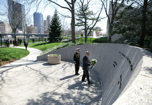 President George W. Bush lays flowers at the gravesite of former President Gerald R. Ford, Friday, April 20, 2007, during a visit to Grand Rapids, Mich. White House photo by Eric Draper