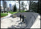 President George W. Bush lays flowers at the gravesite of former President Gerald R. Ford, Friday, April 20, 2007, during a visit to Grand Rapids, Mich. White House photo by Eric Draper