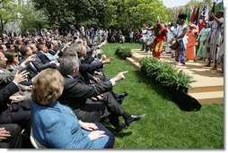 The audience takes part in a performance by the Kankouran West African Dance Company during a ceremony marking Malaria Awareness Day Wednesday, April 25, 2007, in the Rose Garden. White House photo by Eric Draper