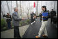 President George W. Bush reaches out to welcome Prime Minister Shinzo Abe to Camp David Friday, April 27, 2007. The leaders are expected to discuss their close cooperation in global affairs. White House photo by Eric Draper