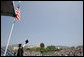 A graduate of the University of Pepperdine's Seaver College raises his diploma Saturday, April 28, 2007, during commencement ceremonies in Malibu, California. The event was highlighted by an address from Mrs. Laura Bush, who also received an honorary Doctor of Laws degree from the school. White House photo by Shealah Craighead