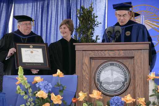 Mrs. Laura Bush receives an honorary Doctor of Laws degree from Dr. Andrew K. Benton, President of Pepperdine University Saturday, April 28, 2007, as Pepperdine Board of Regents member Eff W. Martin, delivers the Conferring Statement. The presentation came during the commencement ceremonies for the Class of 2007 at Pepperdine's Seaver College in Malibu. White House photo by Shealah Craighead