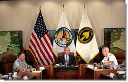 President George W. Bush joins Admiral William Fallon, right, Commander of the U.S. Central Command, and General Doug Brown, Commander U.S. Special Operations Command, during a visit Tuesday, May 1, 2007, to CENTCOM at MacDill Air Force Base in Tampa, Fla.  White House photo by Eric Draper