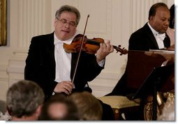 Violinist Itzhak Perlman plays during the entertainment portion of the White House State Dinner in honor on Her Majesty Queen Elizabeth II, Monday evening, May 7, 2007, in the East Room at the White House. White House photo by Shealah Craighead