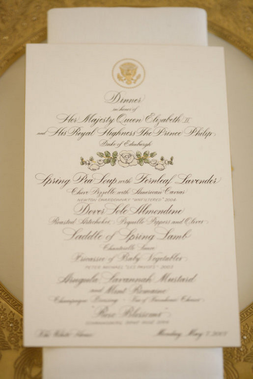 A menu is seen atop a table setting arrangement for the State Dinner at the White House Monday, May 7, 2007, hosted by President George W. Bush and Mrs. Laura Bush in honor of Her Majesty Queen Elizabeth II and His Royal Highness The Prince Philip, Duke of Edinburgh, in the State Dining Room. White House photo by Shealah Craighead