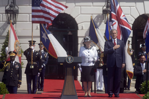 President George W. Bush stands with his hand over his heart during the playing of America's national anthem during the Arrival Ceremony for Her Majesty Queen Elizabeth II and His Royal Highness The Prince Philip Duke of Edinburgh Monday, May 7, 2007, on the South Lawn. White House photo by Lynden Steele