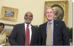 President George W. Bush and President Rene Preval of Haiti stand in the Oval Office Tuesday, May 8, 2007, during a photo opportunity with the media. The leaders were expected to discuss a range of issues, including recent efforts by the United Nations stabilization mission in Haiti to enhance security and opportunities for promoting growth and prosperity in Haiti.  White House photo by Joyce N. Boghosian