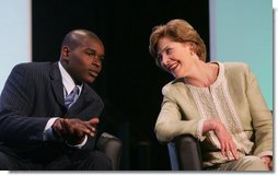 Mrs. Laura Bush talks with student Lyle Oates of the YouthBuild Alternative School in Cambridge, Mass., following her address Wednesday, May 9, 2007 in Washington, D.C., at the National Summit on America’s Silent Epidemic highlighting America’s high school dropout crisis. Mrs. Bush encouraged communities across the nation to come together and take action to reduce the high school dropout rate. Oates, who was out of school for two years, is now working toward his diploma and plans to attend college. White House photo by Joyce N. Boghosian