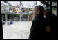 President George W. Bush views the damage done last week's deadly tornado during a stop at the John Deere dealership in Greensburg, Kansas Wednesday, May 9, 2007. At least 11 people died and more than 90 percent of the town was destroyed in the wake of the storm that struck Friday night. White House photo by Eric Draper