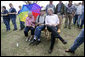 President George W. Bush spends a moment with Cloriene and Kenneth Smith, survivors of Friday's deadly tornado in Greensburg, Kansas, during his visit to the storm-ravaged area Wednesday, May 9, 2007. White House photo by Eric Draper