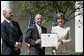 Mrs. Laura Bush presents a plaque to Craig Heller, center, president of Loftworks and John Steffen, left, president of Pyramid Construction, honoring them with a 2007 Preserve America Presidential Award in the Rose Garden at the White House Wednesday, May 9, 2007. The Steffen and Heller companies were honored for their work in preserving and revitalizing the historic downtown of St. Louis, Mo. White House photo by Joyce Boghosian