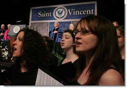 President George W. Bush stands for the singing of the national anthem Friday, May 11, 2007, prior to delivering the commencement address at Saint Vincent College in Latrobe, Pa. White House photo by Joyce N. Boghosian