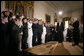 President George W. Bush attends a commissioning ceremony for Joint Reserve Officer Training Corps Thursday, May 17, 2007, in the East Room of the White House, as U.S. Secretary of Defense Robert Gates administers the commissioning oath to the ROTC members. White House photo by Eric Draper