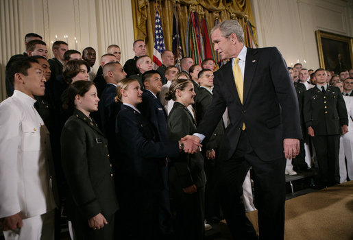 President George W. Bush congratulates newly commissioned members of the Joint Reserve Officer Training Corps Thursday, May 17, 2007, in the East Room of the White House, after U.S. Secretary of Defense Robert Gates administered the commissioning oath to the ROTC members. White House photo by Eric Draper