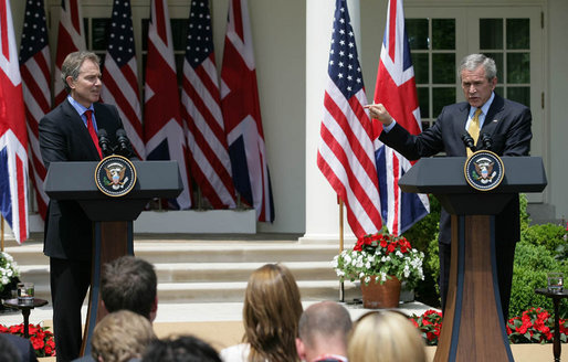 President George W. Bush points emphatically towards Prime Minister Tony Blair in the Rose Garden Thursday, May 17, 2007, as he tells the media, "What I know is the world needs courage. And what I know is this good man is a courageous man." White House photo by Eric Draper