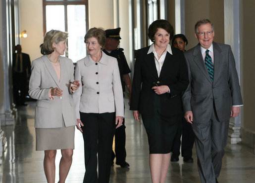 Mrs. Laura Bush is joined by U.S. Senators Kay Bailey Hutchison, R-Texas, left, Dianne Feinstein, D-Calif. and Mitch McConnell, R-Ky, right, as she arrives to attend the Senate Women’s Caucus Wednesday, May 23, 2007 at the U.S. Capitol in Washington, D.C., calling for the unconditional release of Nobel laureate and Myanmar opposition leader Aung San Suu Kyi. White House photo by Shealah Craighead