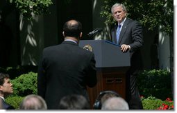 President George W. Bush listens to a question Thursday, May 24, 2007, during a press conference in the Rose Garden. The President said, "Today, Congress will vote on legislation that provides our troops with the funds they need. It makes clear that our Iraqi partners must demonstrate progress on security and reconciliation. As a result, we removed the arbitrary timetables for withdrawal and the restrictions on our military commanders that some in Congress have supported."  White House photo by Chris Greenberg