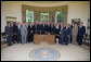 President George W. Bush stands with the recipients of the 2006 President's "E" award and "E" Star award for export achievement, May 24, 2007, in the Oval Office. The “E” Award is presented by the Department of Commerce to persons and organizations engaged in the marketing of products that make significant contributions to the expansion of the export trade of the United States. White House photo by Joyce Boghosian