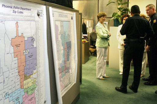 Mrs. Laura Bush pauses to talk with Phoenix Police officers Friday, May 25, 2007, after stopping at the Childhelp Children's Advocacy Center during her Southwest visit. White House photo by Shealah Craighead