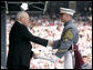 Vice President Dick Cheney presents a diploma to a U.S. Military Academy graduate during commencement ceremonies at Michie Stadium Saturday, May 26, 2007, in West Point, N.Y. White House photo by David Bohrer