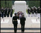 President George W. Bush is joined by Major General Guy Swan III, left, commander of the Military District of Washington, during the Memorial Day commemoration wreath laying ceremony at the Tomb of the Unknowns Monday, May 28, 2007, at Arlington National Cemetery in Arlington, VA. White House photo by Shealah Craighead