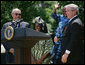 President George W. Bush holds Baron Mosima Loyiso Tantoh in the Rose Garden of the White House Wednesday, May 30, 2007, after delivering a statement on PEPFAR, the President's Emergency Plan for AIDS Relief. With them are the boy's mother, Kunene Tantoh, representing Mothers to Mothers, which provides treatment and support services for HIV-positive mothers in South Africa, and Dr. Jean "Bill" Pape, internationally recognized for his work with infectious diseases. White House photo by Chris Greenberg