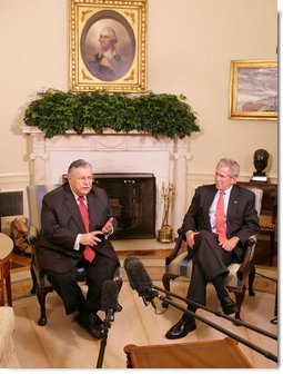 President George W. Bush listens as President Jalal Talabani of Iraq addresses members of the media in the Oval Office Thursday, May 31, 2007.  White House photo by Eric Draper